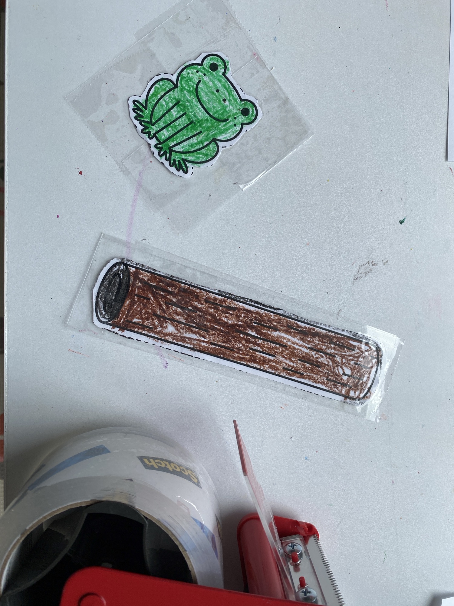 packing tape on the frogs and log