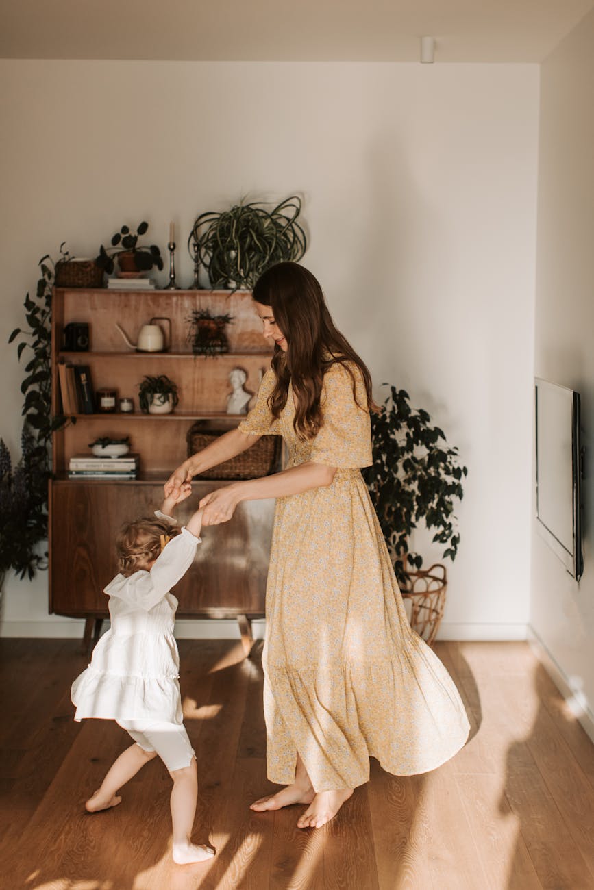 mother dancing with daughter to music