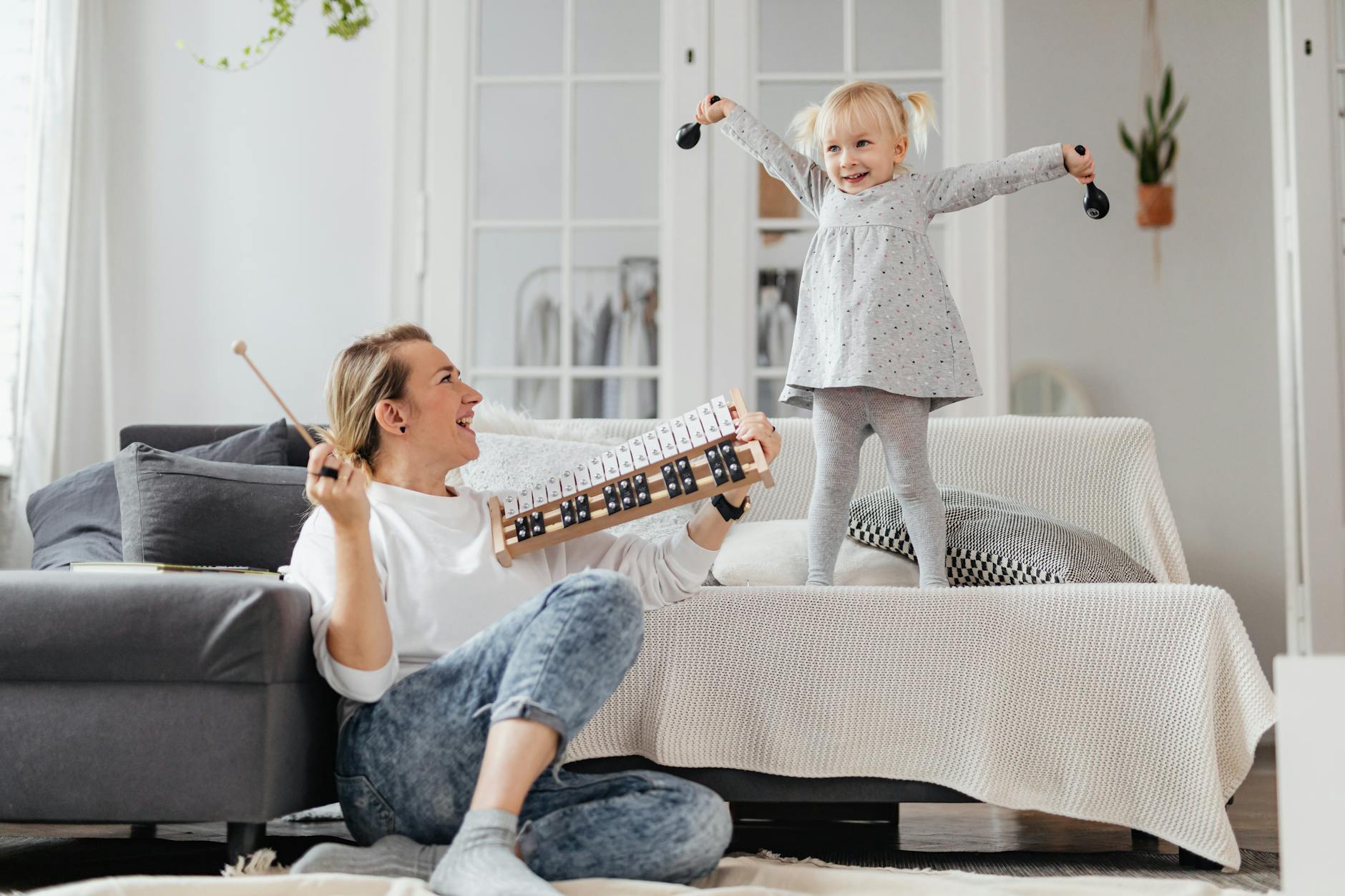 mother and daughter play music together