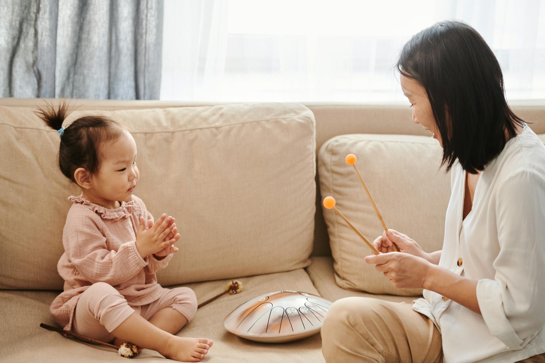 mother and daughter playing music together