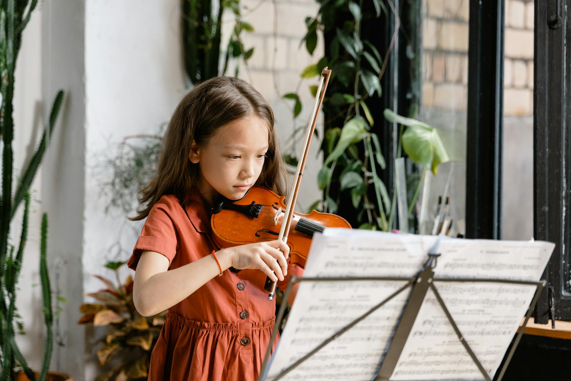 girl practicing the violin
