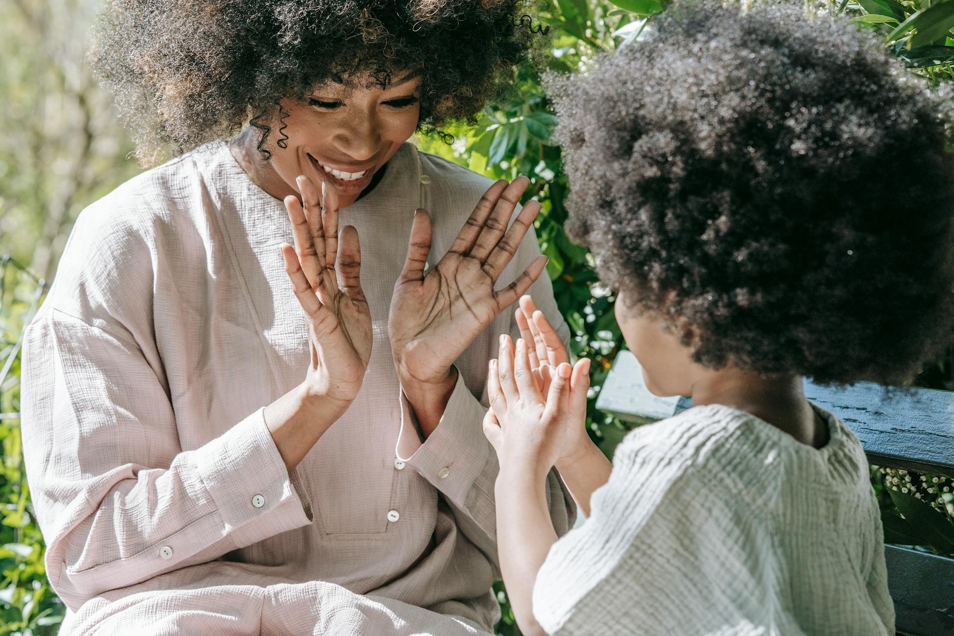 mother and daughter clapping