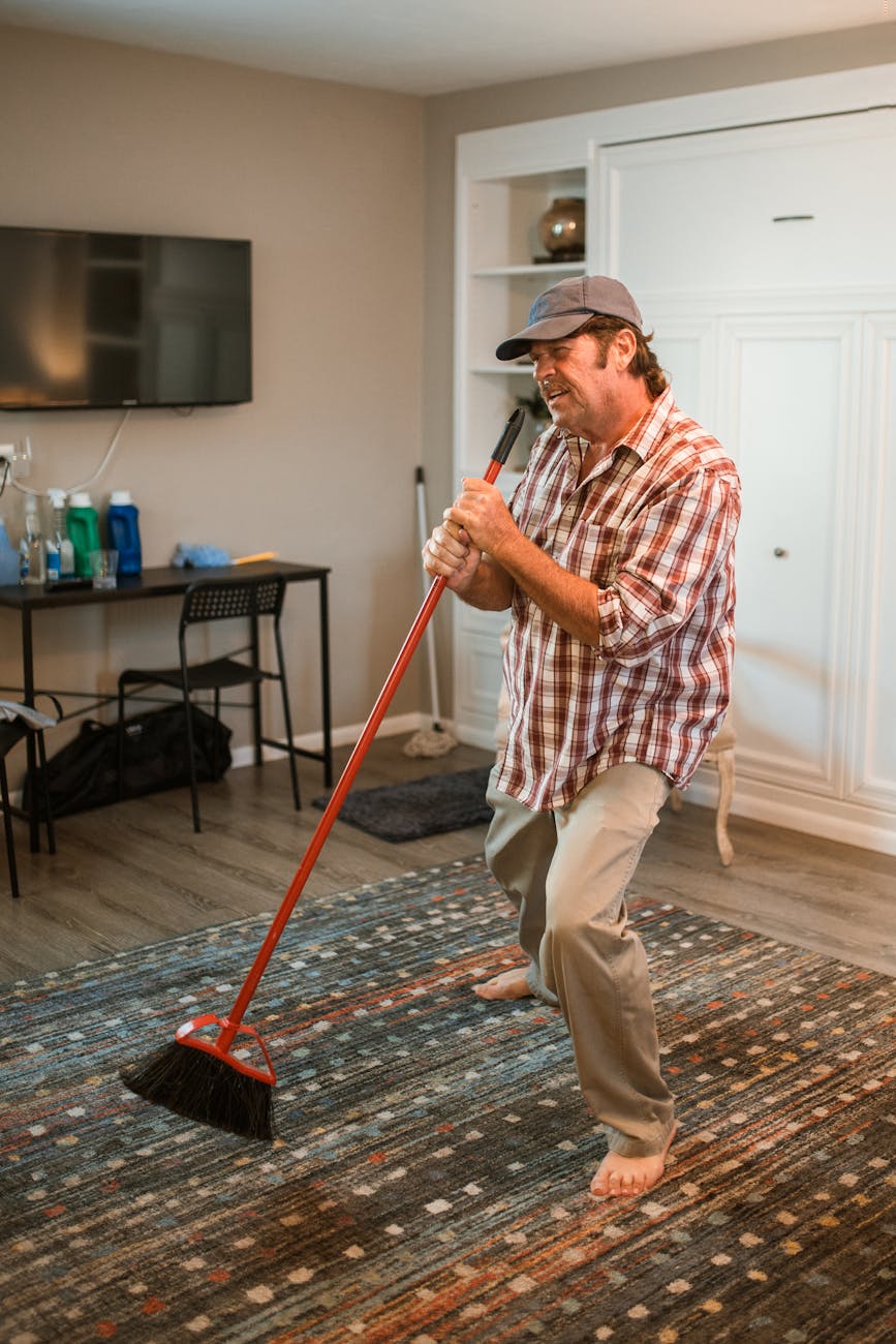 man singing into his broom